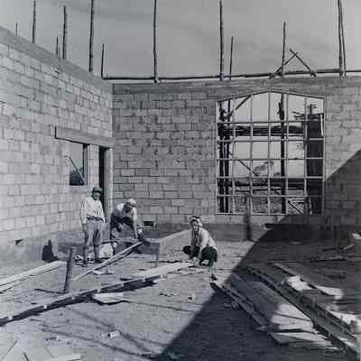 Japanese civilians constructing a brick building