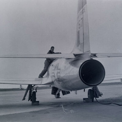 Ground crew servicing an Air Force jet fighter