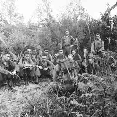 Infantry platoon receiving instructions during field training