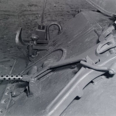 Soldier looking out tank hatch