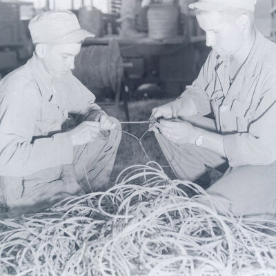 Two soldiers splicing wire