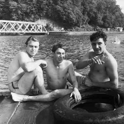 Soldiers relaxing on a pier after swimming