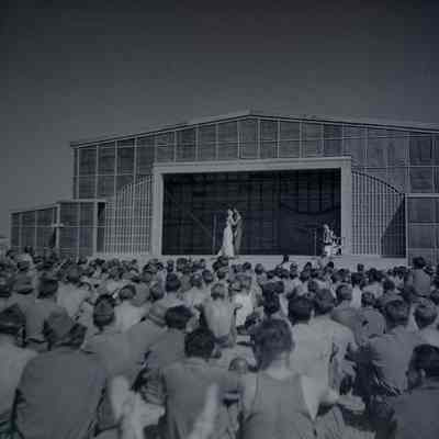 Soldiers watching entertainers on stage
