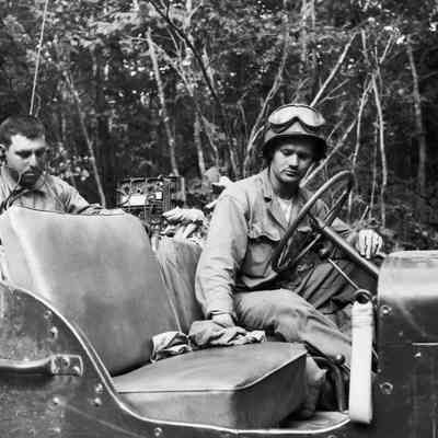 Soldier wiping down seat in Jeep