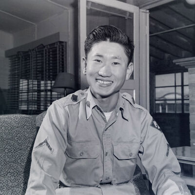 Portrait of unknown soldier sitting on couch