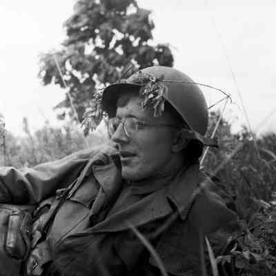 Portrait of soldier resting in the bushes