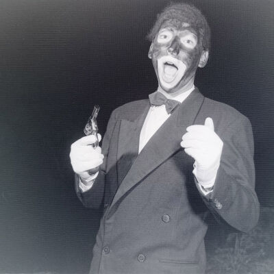 Entertainer in blackface holding a pistol