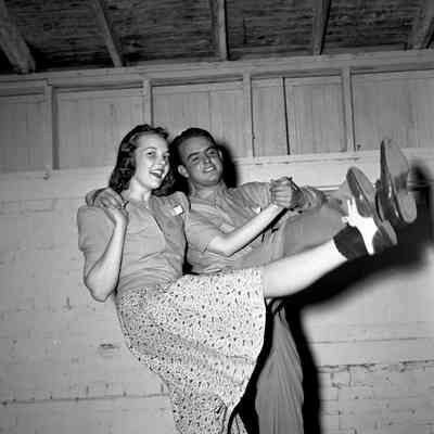 Soldier dancing with a girl