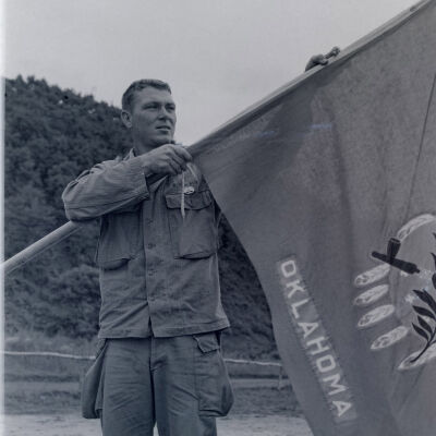 Soldier displaying Oklahoma flag