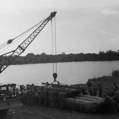 Soldiers training to construct a pontoon bridge