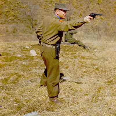 Soldier aiming revolver