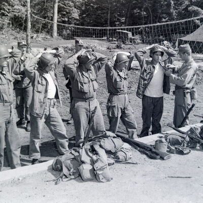 Group of "prisoners" being processed