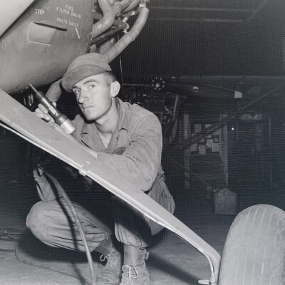 Mechanic working on light aircraft