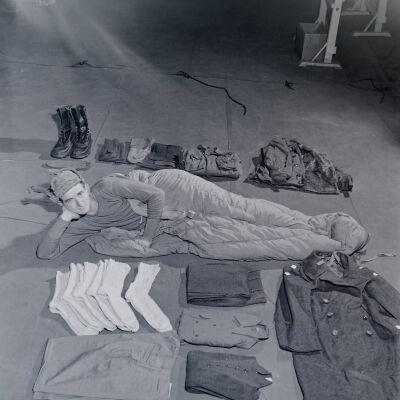 Soldier lounging with field gear clothing