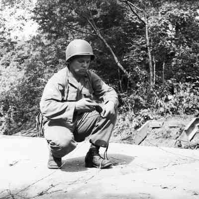 Soldier working with communication wire
