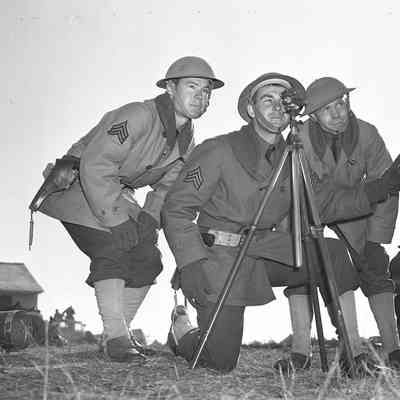 Soldiers looking through spotting scope