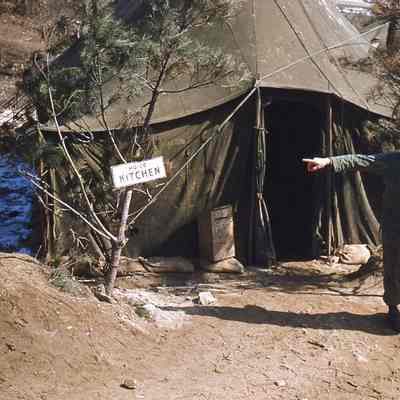 Soldiers pointing to the kitchen tent