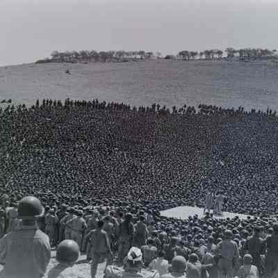 Large crowd of soldiers watching entertainers
