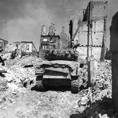 Tank moves through rubble