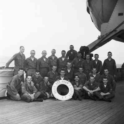 Group of soldiers on ship's deck with life preserver "USNS Gen Hugh J Gaffey SF"