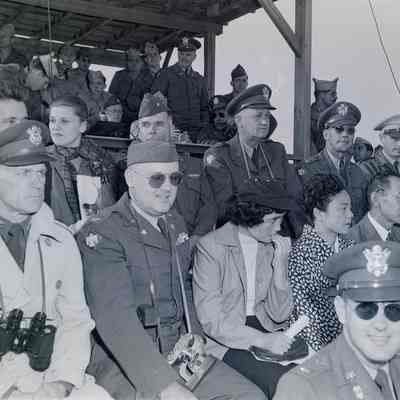 General Styron and a group of senior officers and guests at an outdoor sporting event