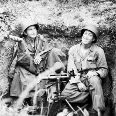 Soldiers with their mortar in foxhole