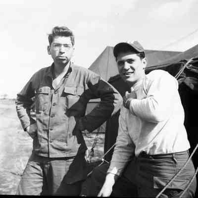 Two soldiers in front of a tent