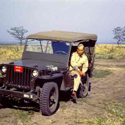 Soldier sitting in a jeep