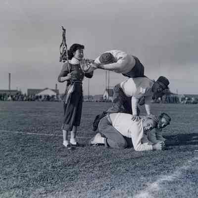 Sally Tomarikawa with soldiers performing gymnastics