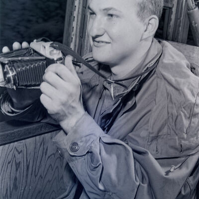 Soldier holding a camera
