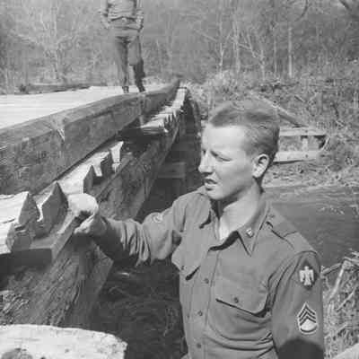 Soldier checking bridge structure