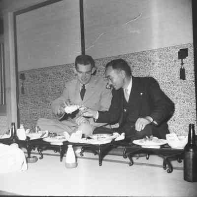 Soldier and Japanese man at a formal dinner