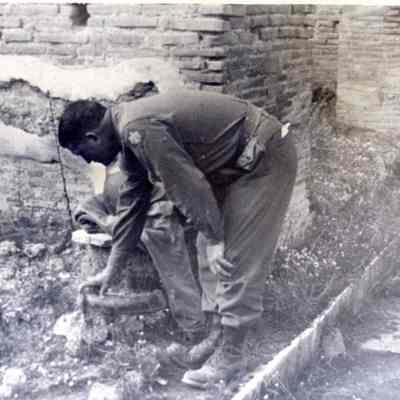 Soldier inspecting plumbing