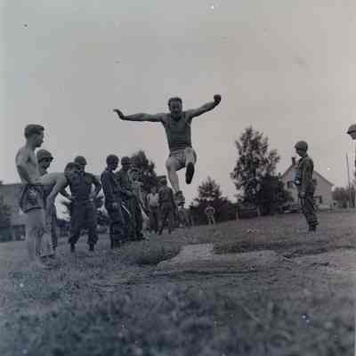 Soldier performing long jump