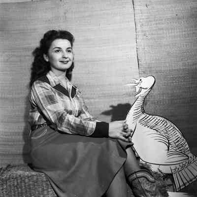 Woman with cartoon turkey cutout