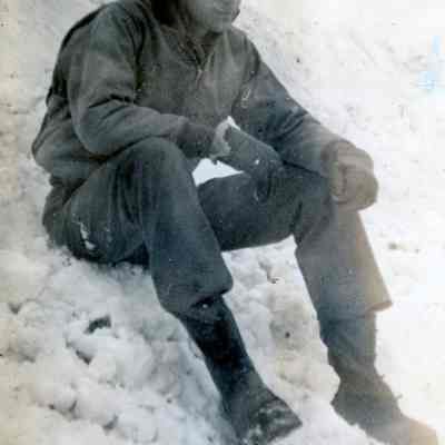 Officer sitting in the snow
