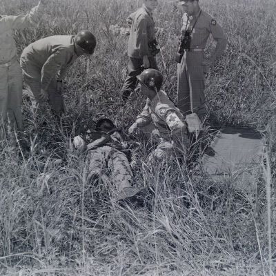 Medics working a wounded man during war games