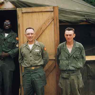 Soldiers standing in a tent doorway