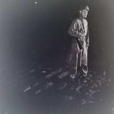 Night photo of a soldier on guard duty