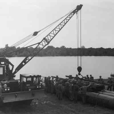 Soldiers training to construct a pontoon bridge