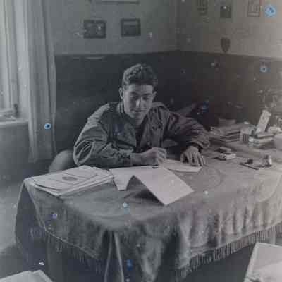 Soldier working at table