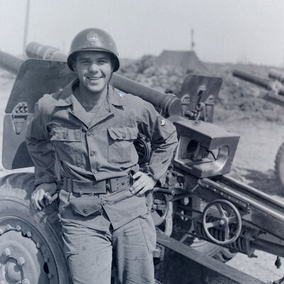 Soldier next to a field gun