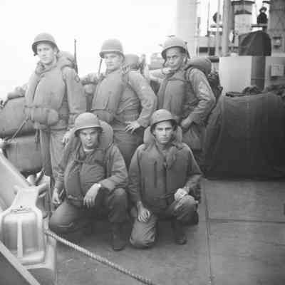 Soldiers on deck with life vests