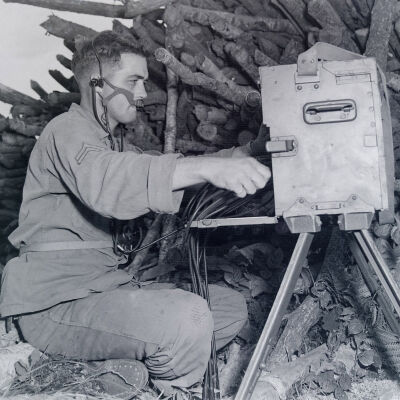 Soldier operating a telephone field switchboard