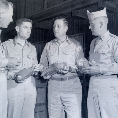 Group of soldiers and officers sampling bread