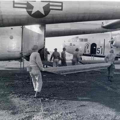 Connecting cargo ramps to a C-119 aircraft