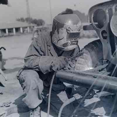 Soldier welding with decorated helmet