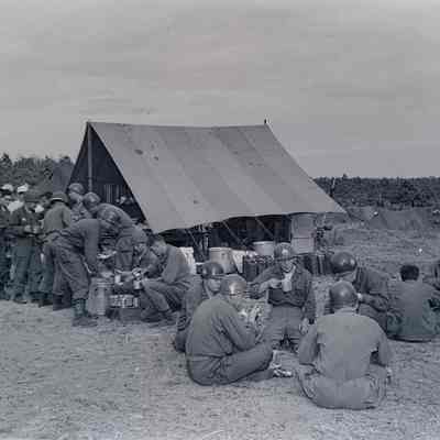Soldiers in line for food at a field kitchen