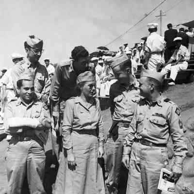 Soldiers talking with woman at track athletics event