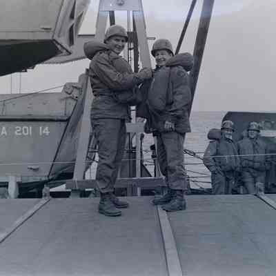 Group photo of soldiers onboard a ship